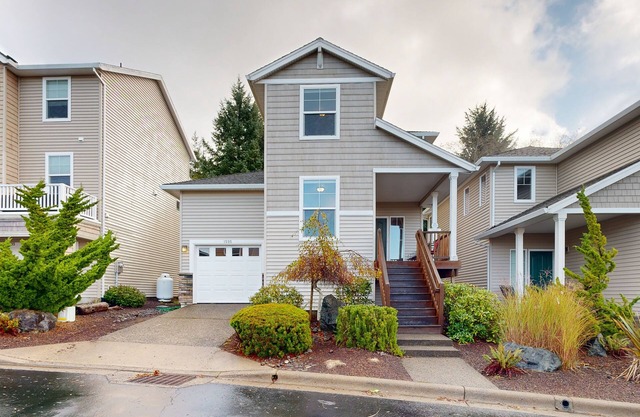 Modern Ocean Highlands home with Netarts Bay & ocean views, fireplace - dogs OK