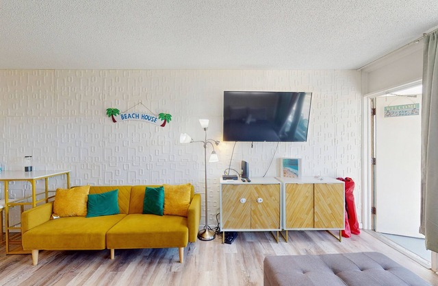 Modern oceanview condo with a kitchenette, balcony and beach access