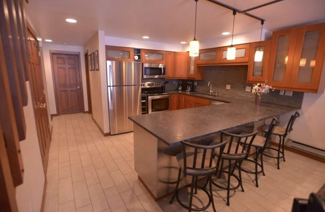 Modern style 3-bedroom condo close to downtown, lake, beaches, parks, and golf.