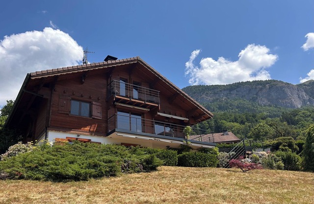 Mountain chalet with pool & stunning views, close to skiing & summer activities.