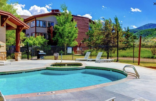 Mountain retreat with fireplace, hot tub, pool, & fitness room