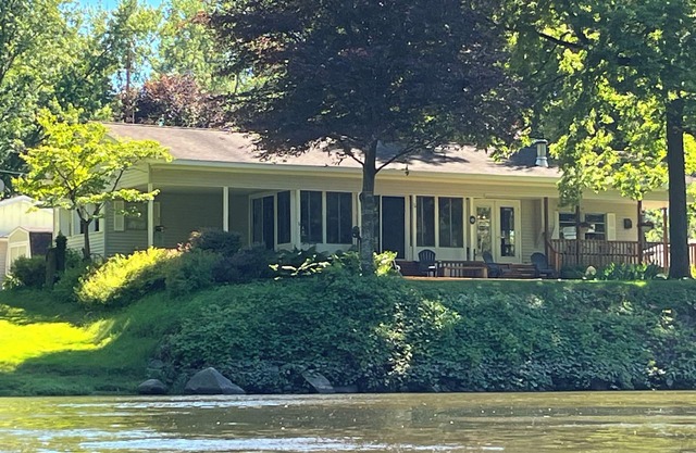 Muskegon River Cottage just steps from the river on a low bank.