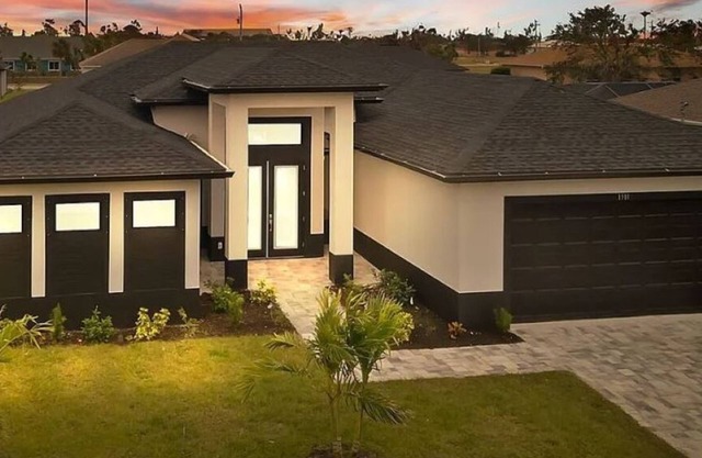 New Construction - Elegant Fresh Water Canal Home w/Heated Pool