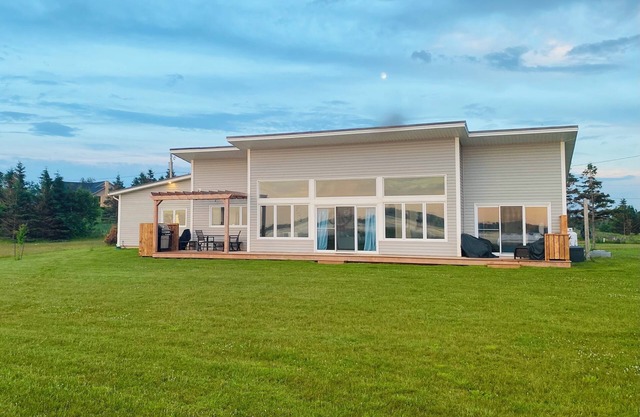 New Waterfront Modern Home with 180 degree views over Rustico Bay!