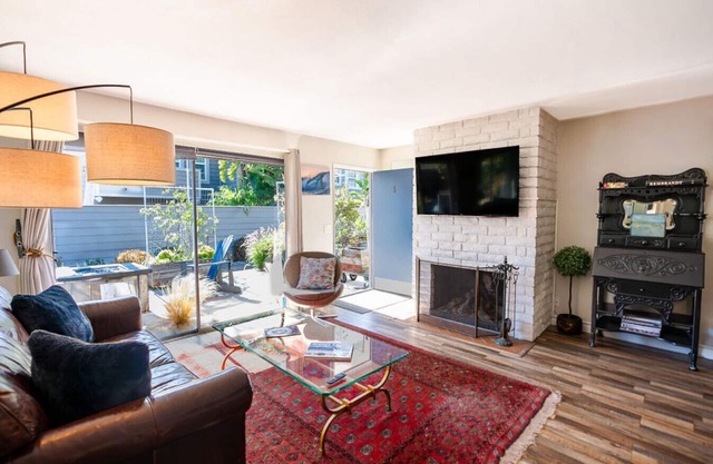 Newly remodeled, uniquely styled property surrounded by botanical-like garden setting.