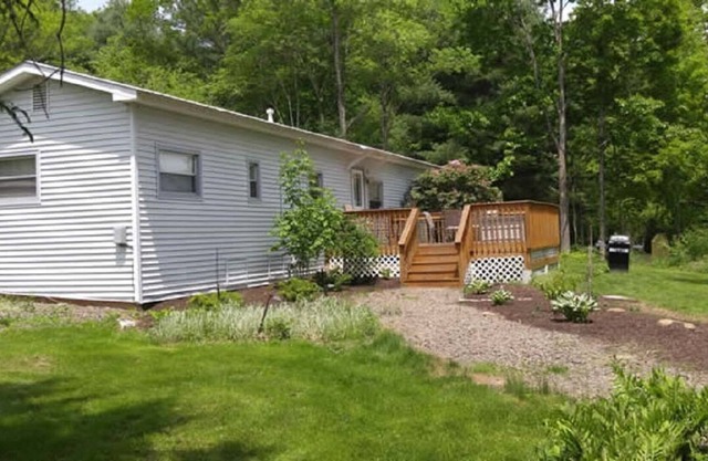 Newly renovated home on 13 acres with a beautiful pond, great for fishing!