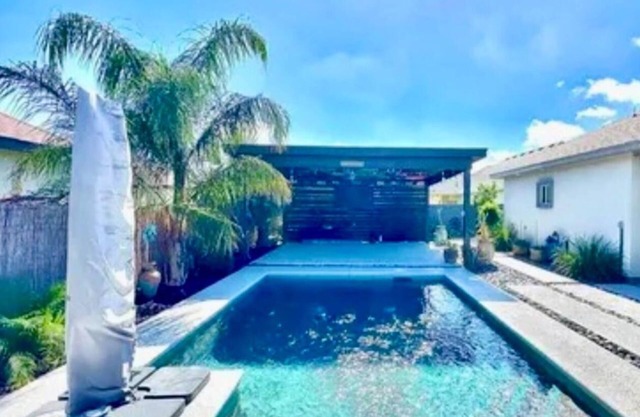 North Brownsville home with pool and pergola.nBeautiful backyard oasis feeling.