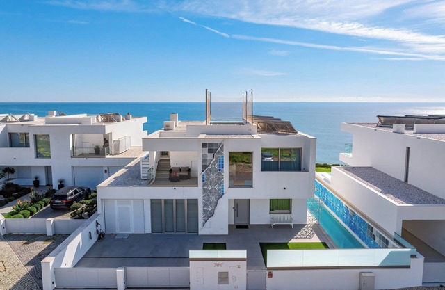 Ocean Front Algarve. Chic, modern villa with two pools in quaint fishing village
