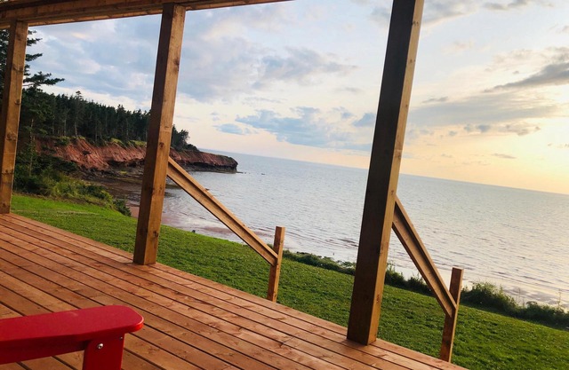 Ocean-front cottage on private, treed lot.