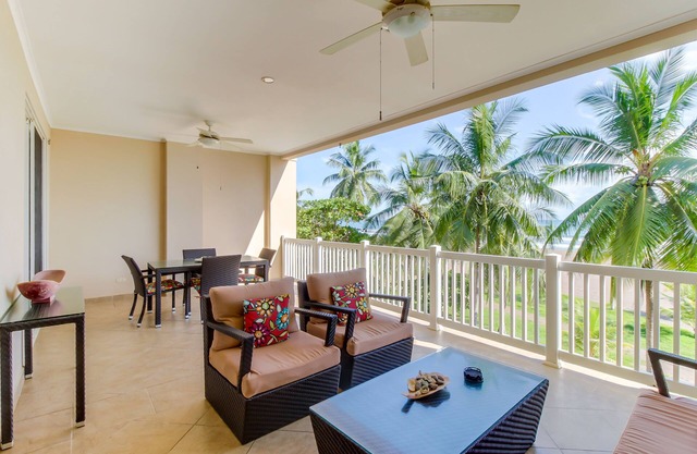 Oceanfront condo with sweeping beach views, pool & private balcony