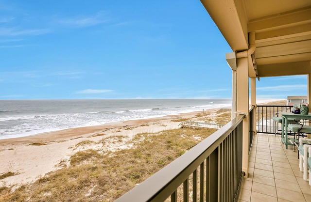 Oceanfront, dog-friendly condo with sunrise views, balcony & beach access