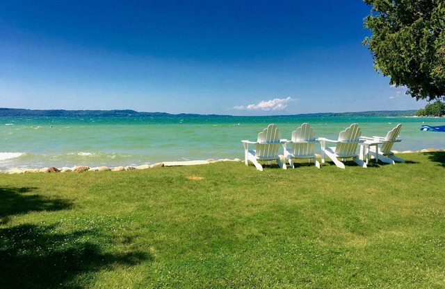 ON TORCH LAKE SANDY BEACH COTTAGE HOME! AMAZING SUNSETS! LARGE YARD JUST OPENED