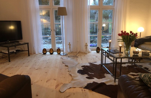 Orangery in the park-like rose garden, wildflower meadow, apiary and pond -