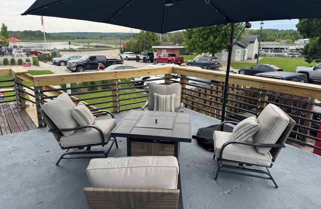 Overlooks the Marina in East Jordan’s South Arm. Located next door to MOM’s Bar