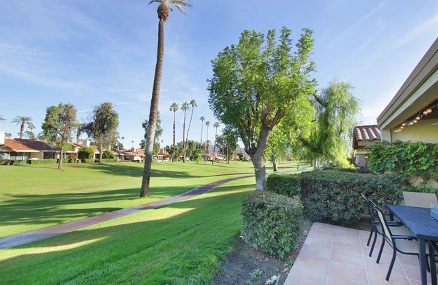 Palm Desert in C.C. Golf course view. Pools in community.