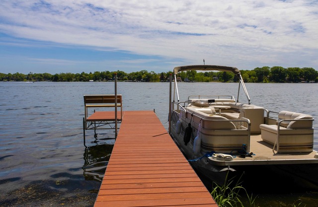 Pet Friendly 2 Lakefront Cottages with Pontoon Boat, Kayaks, Firepit and Sandbar