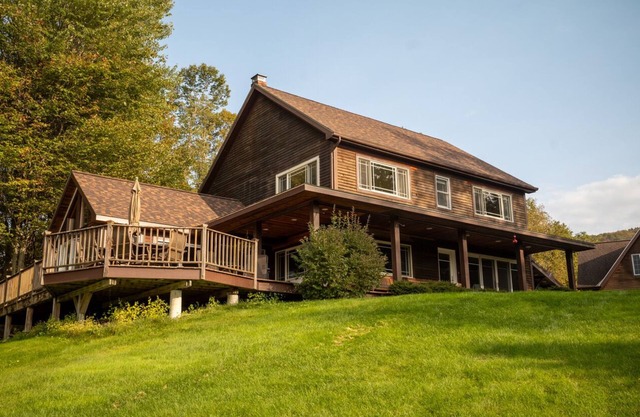Private hilltop home close to skiing. Enjoy views, hot tub & fire pit!