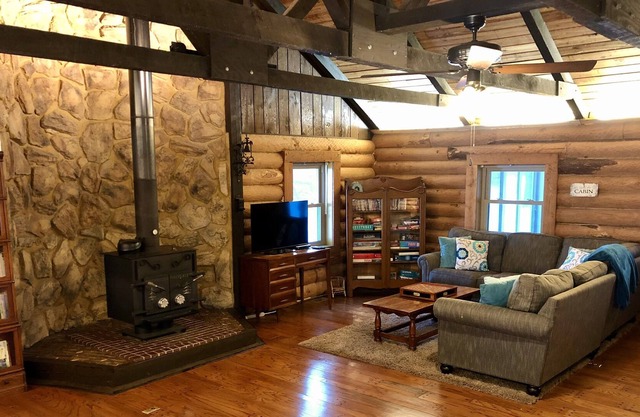 PRIVATE LOG CABIN RETREAT! Secluded Cabin in Woods with Pond and Bike Trail!
