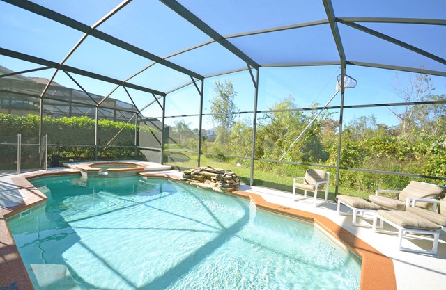 Private pool with waterfall feature. Popular 4 bed, 3 bath villa in Windwood Bay