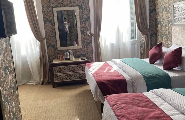 PRIVATE QUADRUPLE ROOM. TOWN VIEW