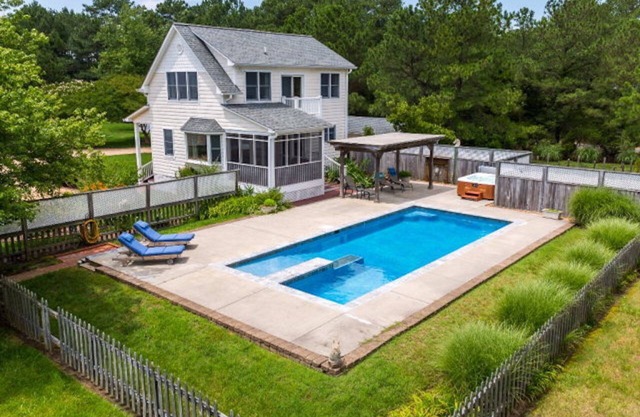 Private, secluded waterfront cottage - pool and hot tub feet from the back door.