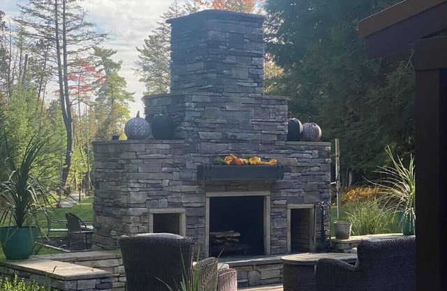 Private Water View . Boat TORCH LAKE ! Dock,Fireplace,Pizza Oven,Hottub!