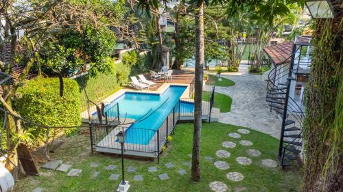 Refúgio da ilha: 6 suítes, piscina e churrasqueira