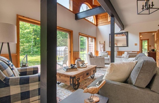 Regally rustic, spacious 2-home waterfront getaway for 16+ with total privacy.