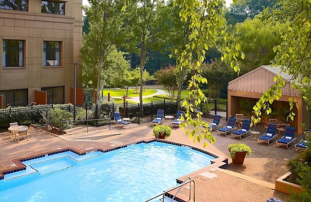 Relax and Unwind! Enjoy Spacious unit w/Kitchen. Swimming Pool Access & Parking