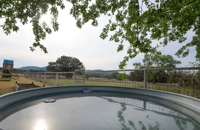 Relax with Hill Country Views! Stock tank POOL and great backyard!