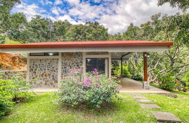 Relaxing, ground-floor bungalow with beautiful garden views and shared pool.