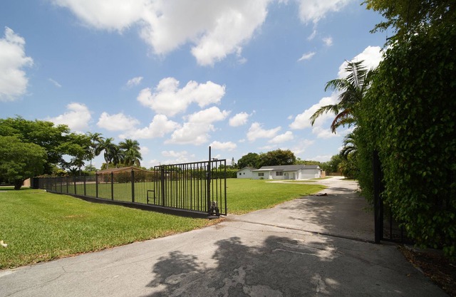 Remodeled 4 large bedrooms & 3 full bath gated house on a 1.1 acre land in Miami