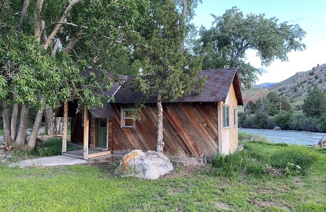 Remodeled Cabin on 40 private acres of Wind River frontage with R/V hookup.n