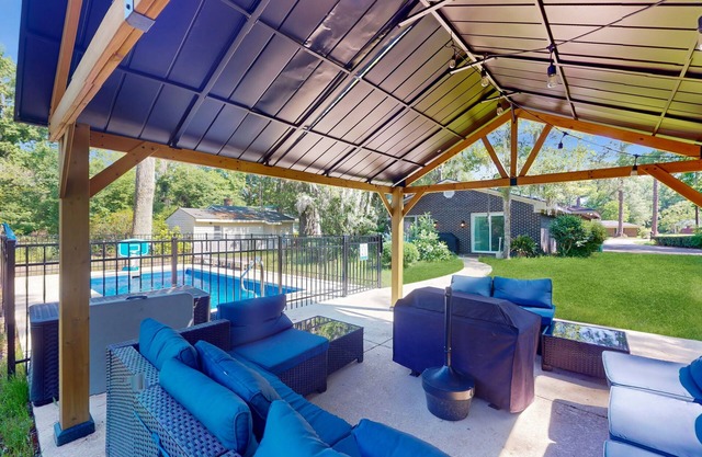 Remodeled home with pool/guest house, new pool, lovely yard & bright interior