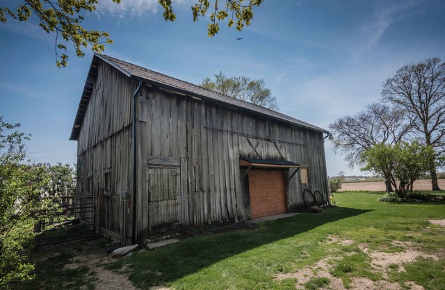 Renovated 1921 vintage farmhouse with barn on one acre of land.