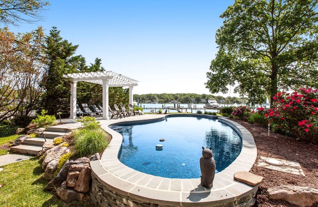 Renovated dog-friendly bayfront home with private hot tub & pool, grill, & dock