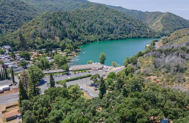 Retro RV with picturesque hills and lake access