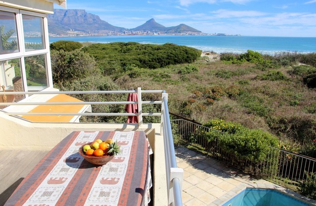 Right on the beach, overlooking Table Mountain, Swimming Pool, Security Complex