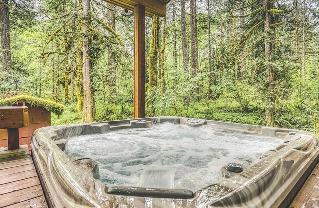 Ripplewood, a serene riverfront cabin, decks, hot tub, BBQ, dog-friendly