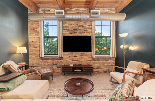 Riverfront Condo for Professionals with Workspace & Prime Medical Mile Access.n