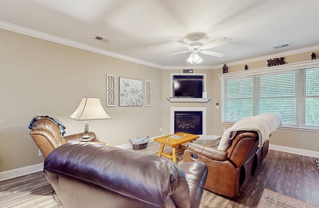 Riverfront oasis with dual suites, 3 fireplaces, central AC, & walkable locale