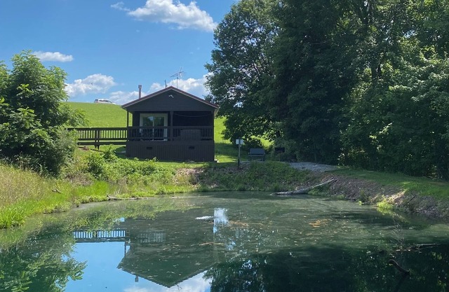 Romantic cabin with fishing and hot tub