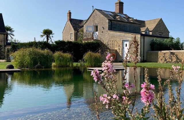 Romantic, quirky farm loft conversion with beautiful natural swimming pool