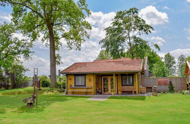 Romantic wooden cottage with lots of art