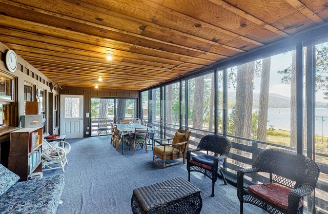 Rustic, lakefront cabin with private dock, beach, screened porch & great view