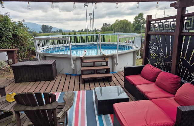 Scenic 2 bedroom walkout suite with hot-tub and outdoor pool, across from Park.