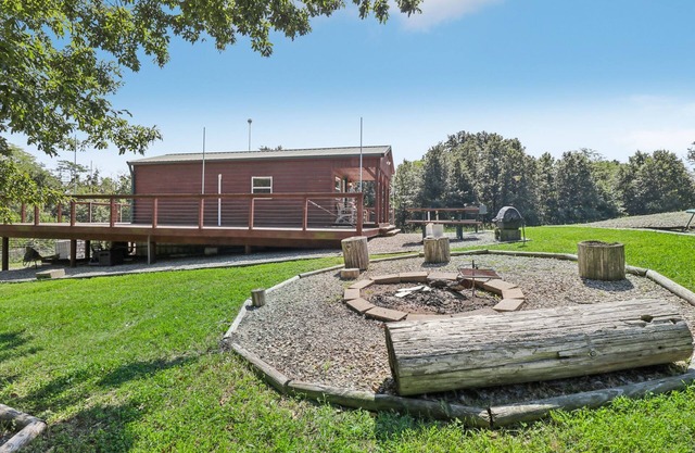 Secluded cabin on farmland with fire pit, pond, a/c & treehouse