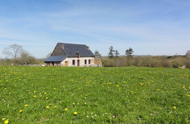 Secluded Eco-Friendly Lodge with Fireplace, Garden, Terrace, and Scenic Views