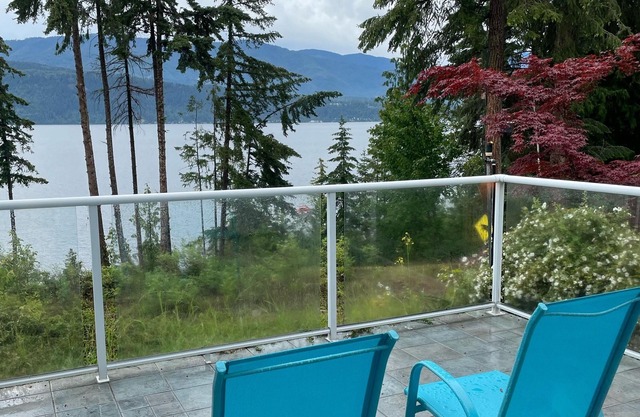 Semi-lake front on Shuswap lake with private beach dock and bouy.
