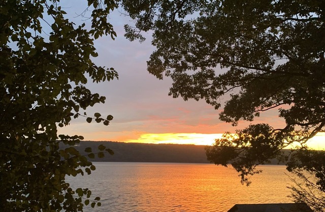 Seneca Lake front cottage on heart of Wine Trail, with gorgeous sunset views.